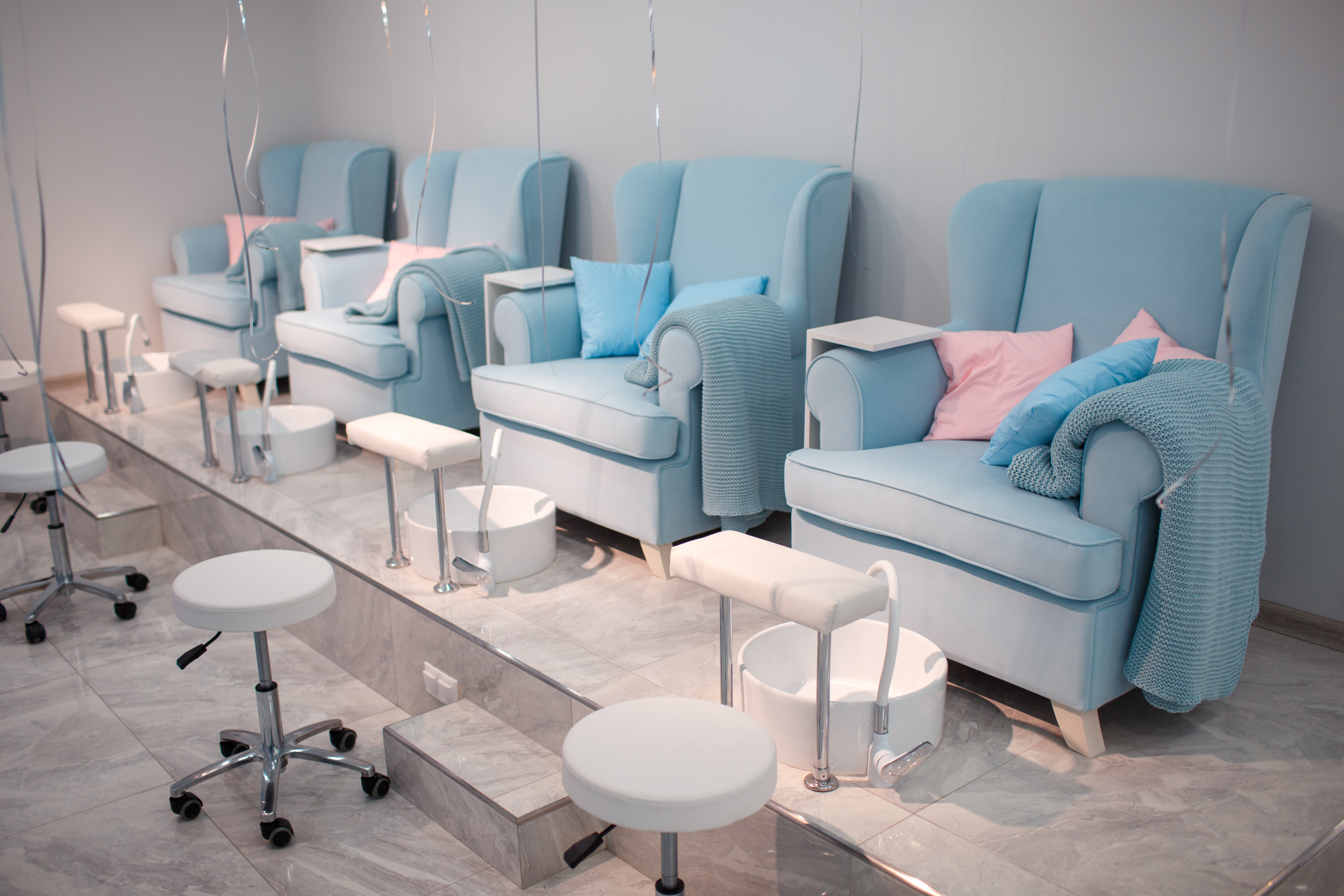 Mpos - Customers enjoying a premium manicure at a modern nail salon using our booking experience.